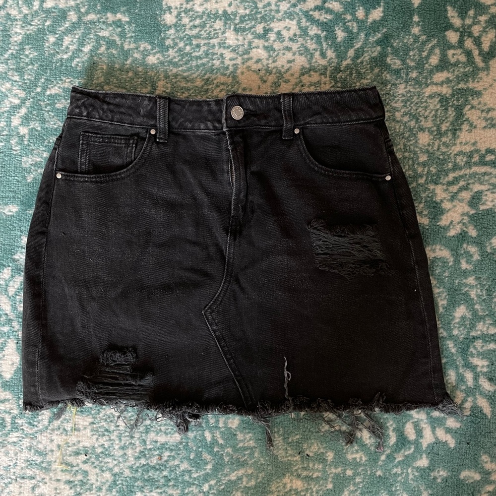 Black distressed denim skirt